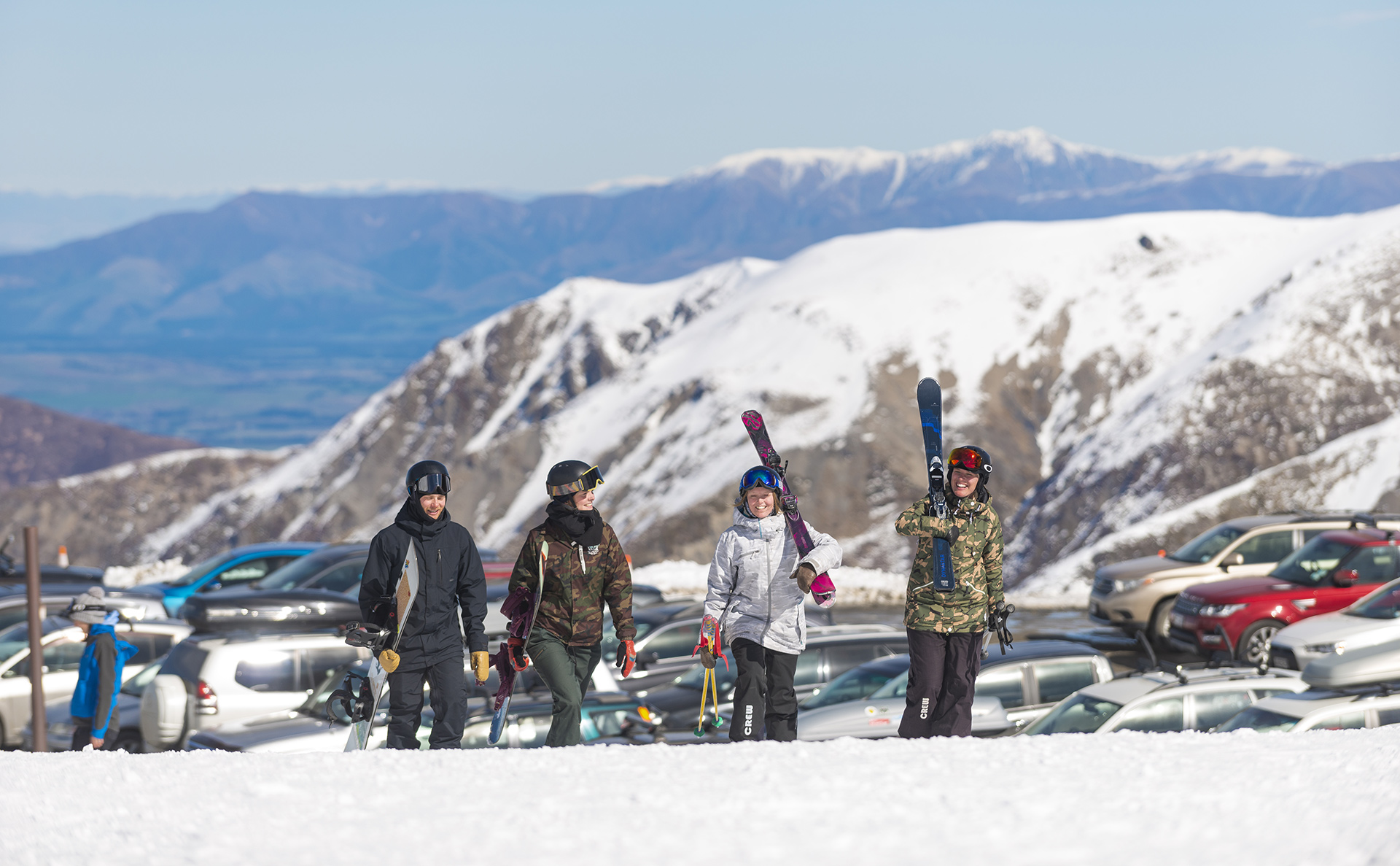 Friends arriving at Mt Hutt ski area with car park in the background